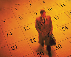 Man walking on a floor in orange portraying as a calendar