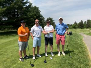 Brian Potter, Mikel Pompeii, Deb Finch and Alex Nitka posing at a golf event