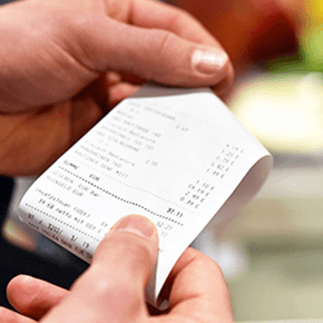 Hands holding a receipt