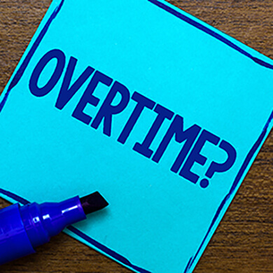 Blue sticky note questioning overtime