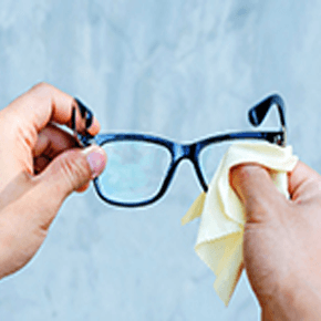 Person cleaning glasses