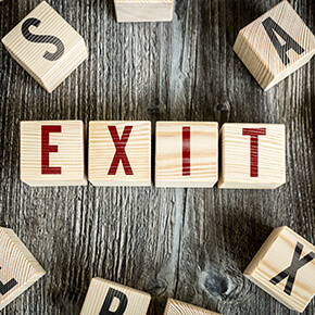 Wooden blocks spelling out "exit"
