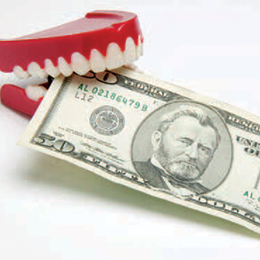 Fake dentures with $20 bill between teeth