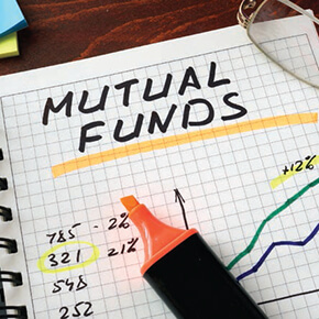 "Mutual Funds" written on grid with drawn graph and orange highlighter
