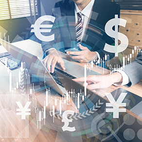 Abstract image of business men on computer with visual representation of foreign currency symbols