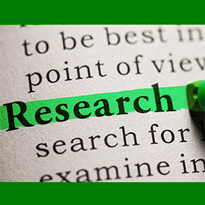 Words in a book with the word "Research" being highlighted in green