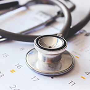 annual checkup concept. stethoscope on the calendar with soft-focus and over light in the background