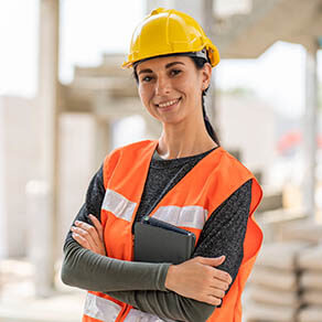 Construction woman smiling with arms folded