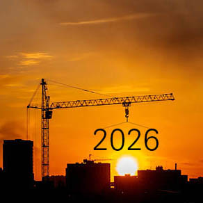 crane lifting "2026" as the sun rises